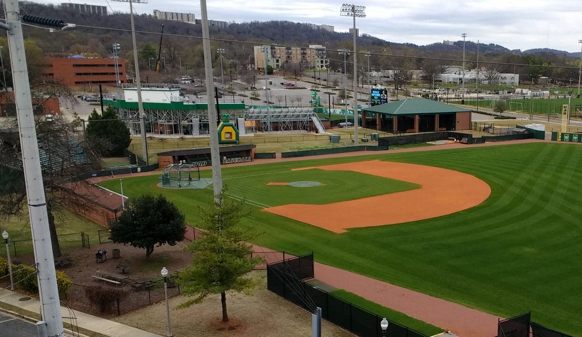 A baseball diamond and outfield seen from above the stands
